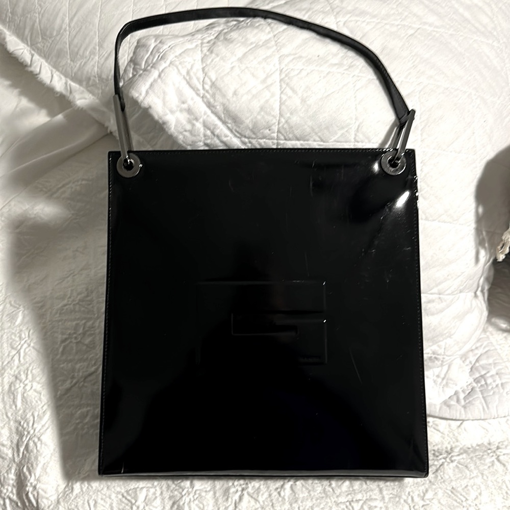 Vintage Gucci black patent leather with silver hardware. Great used condition.